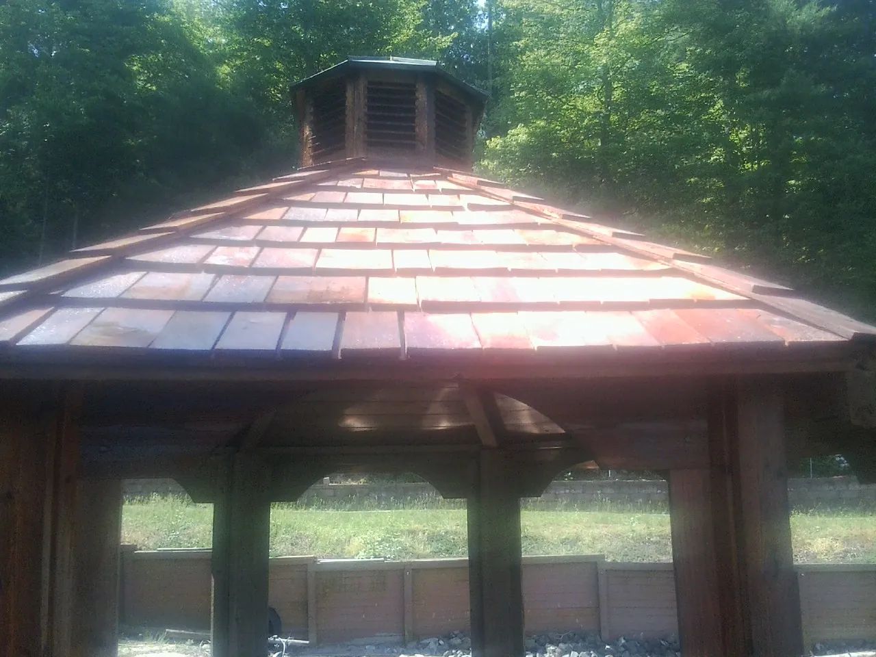 New cedar shake roof and cupola on a lakeside gazebo in Frackville